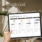 showing goal tracker sheets in front of the workspace